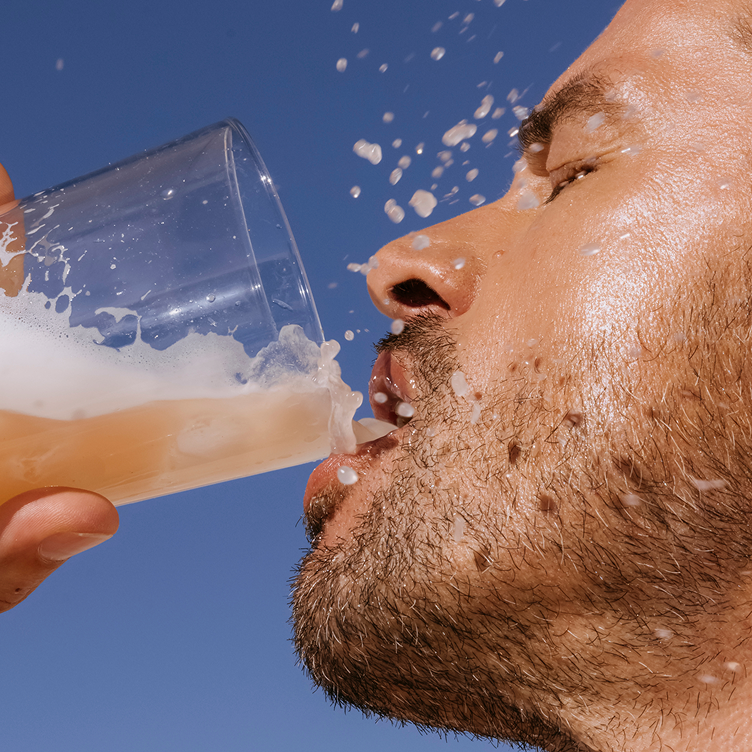 Man drinking ARMRA Sungold Apricot