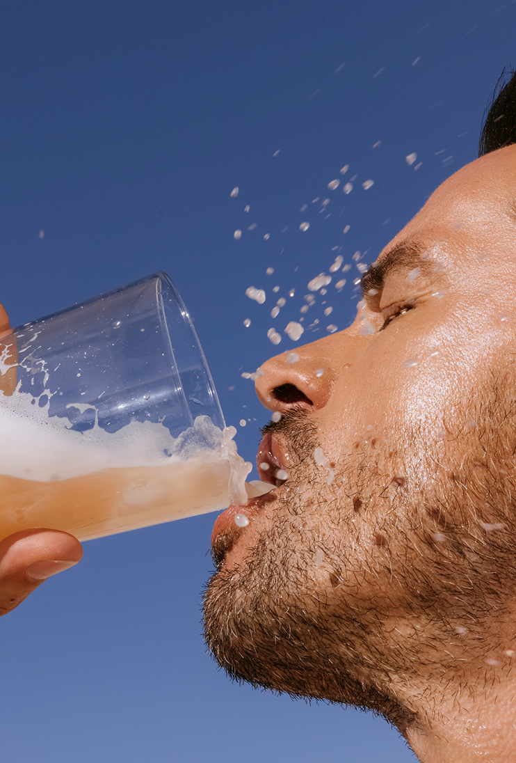 Man drinking ARMRA Sungold Apricot